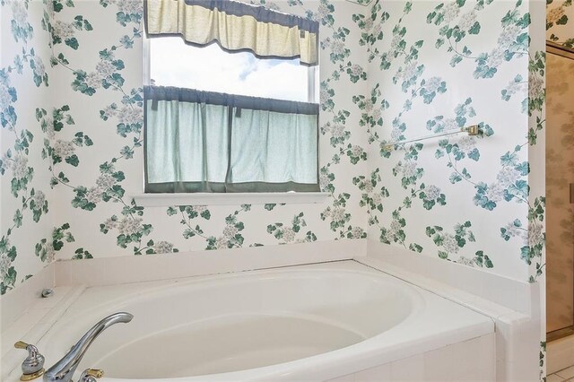 1124 Indigo Ct, Slidell, LA 70460 - full bathroom with wallpapered walls and a garden tub
