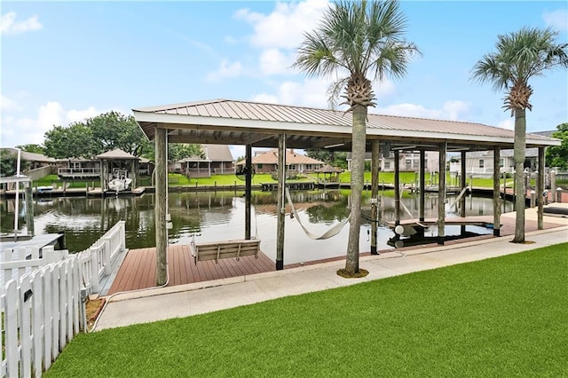 127 Windward Passage St, Slidell, LA 70458 - dock area with boat lift, a lawn, and a water view