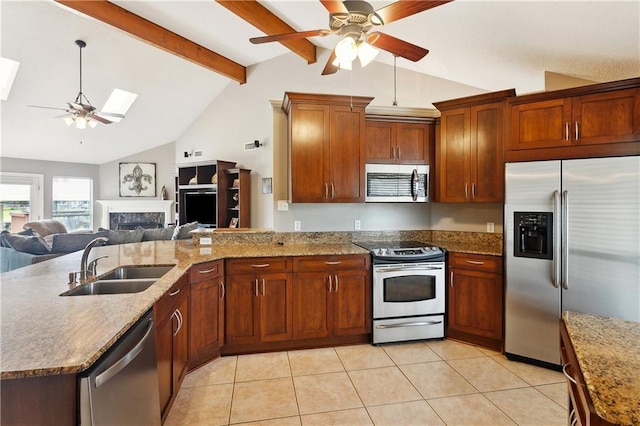 127 Windward Passage St, Slidell, LA 70458 - kitchen featuring appliances with stainless steel finishes, a ceiling fan, a sink, open floor plan, and a peninsula