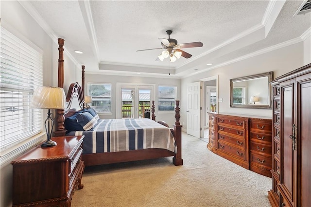 127 Windward Passage St, Slidell, LA 70458 - bedroom featuring a tray ceiling, light carpet, crown molding, access to exterior, and a textured ceiling