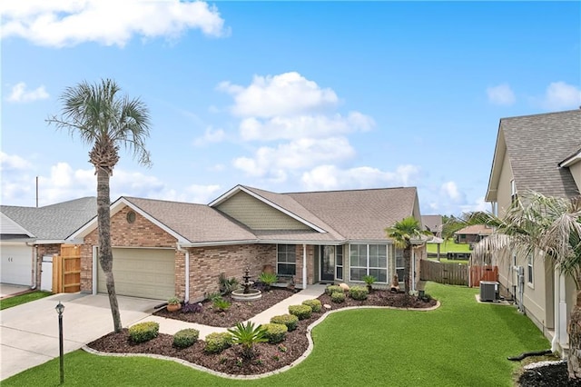 127 Windward Passage St, Slidell, LA 70458 - view of front of house featuring brick siding, a garage, driveway, central AC unit, and a shingled roof