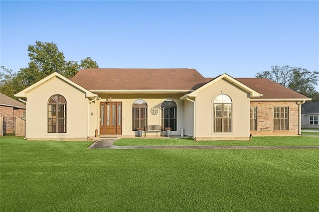 39602 E Tiger Loop, Ponchatoula, LA 70454 - view of front of house featuring a front yard and stucco siding