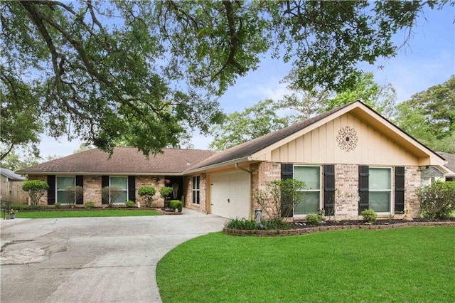 553 Manchester Dr, Slidell, LA 70461 - ranch-style home featuring a front lawn, a garage, concrete driveway, brick siding, and roof with shingles