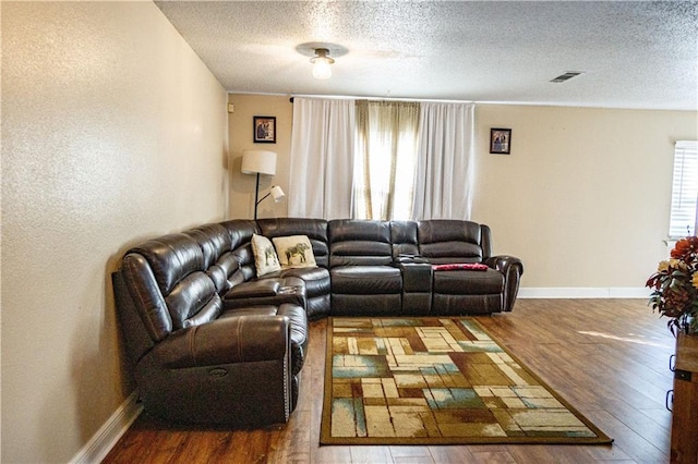 2404 Timbers Dr, Harvey, LA 70058 - living area with hardwood / wood-style floors, a textured ceiling, and baseboards
