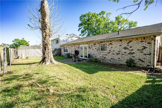 2404 Timbers Dr, Harvey, LA 70058 - view of yard with french doors, central air condition unit, and a patio area