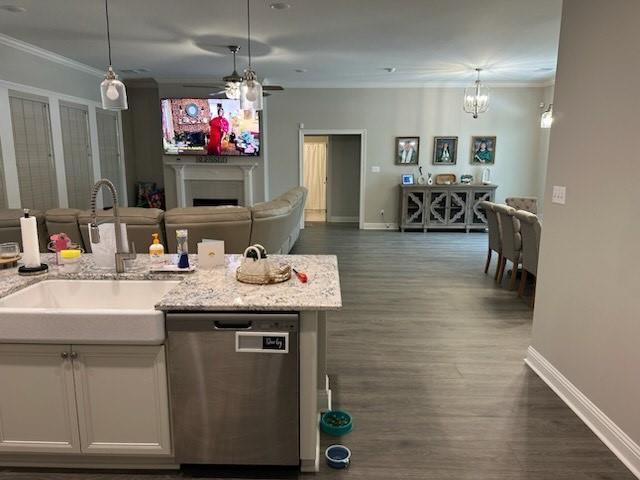 42155 Pasqua Rd, Ponchatoula, LA 70454 - kitchen with dishwasher, baseboards, ornamental molding, a sink, and dark wood finished floors