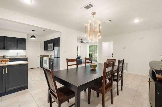71164 Clipper Pl, Abita Springs, LA 70420 - dining area featuring a chandelier, light tile patterned floors, ornamental molding, recessed lighting, and ceiling fan