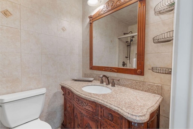 71164 Clipper Pl, Abita Springs, LA 70420 - bathroom with tile walls, vanity, toilet, and a shower