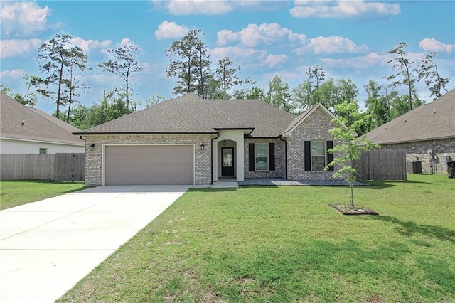 39593 Fly Creek Rd, Ponchatoula, LA 70454 - french country inspired facade featuring an attached garage, driveway, brick siding, cooling unit, and a shingled roof