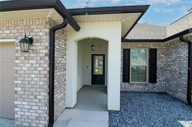 39593 Fly Creek Rd, Ponchatoula, LA 70454 - entrance to property with brick siding, a shingled roof, and a garage