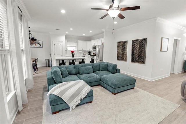 39593 Fly Creek Rd, Ponchatoula, LA 70454 - living room with a ceiling fan, baseboards, ornamental molding, recessed lighting, and light wood-style flooring