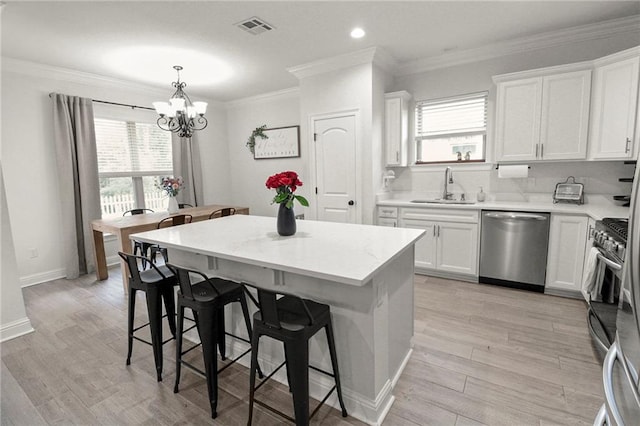 39593 Fly Creek Rd, Ponchatoula, LA 70454 - kitchen with appliances with stainless steel finishes, a sink, healthy amount of natural light, light countertops, and ornamental molding