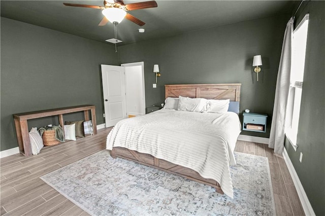 39593 Fly Creek Rd, Ponchatoula, LA 70454 - bedroom with baseboards, wood finished floors, and a ceiling fan