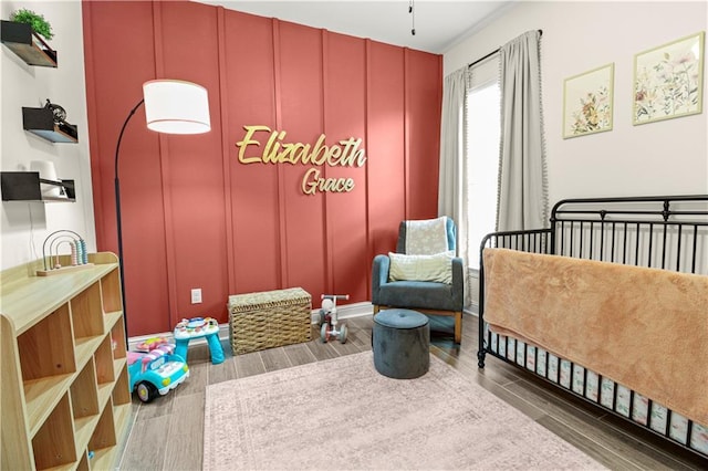 39593 Fly Creek Rd, Ponchatoula, LA 70454 - bedroom with wood finished floors and a decorative wall