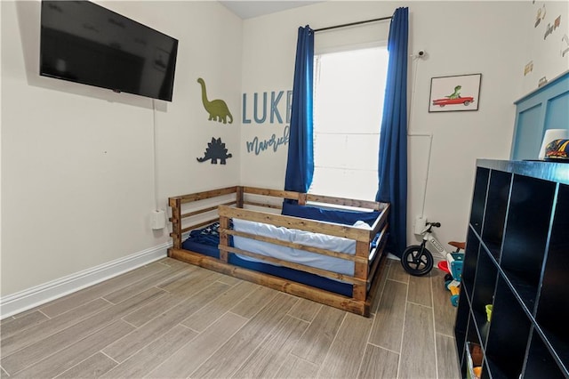 39593 Fly Creek Rd, Ponchatoula, LA 70454 - bedroom featuring wood finished floors and baseboards