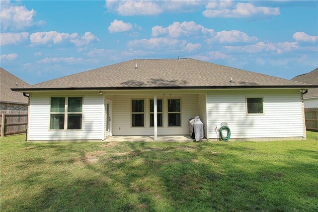 39593 Fly Creek Rd, Ponchatoula, LA 70454 - rear view of house with a patio and roof with shingles
