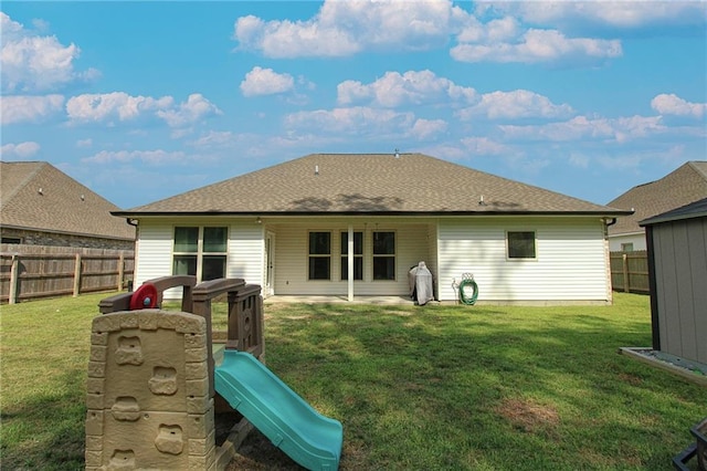 39593 Fly Creek Rd, Ponchatoula, LA 70454 - back of property featuring roof with shingles and a playground