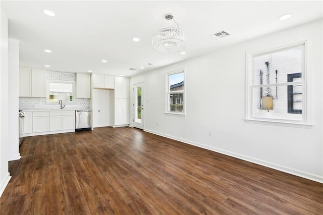 1221 Gaudet Dr, Marrero, LA 70072 - unfurnished living room with dark wood-style floors, a chandelier, and recessed lighting