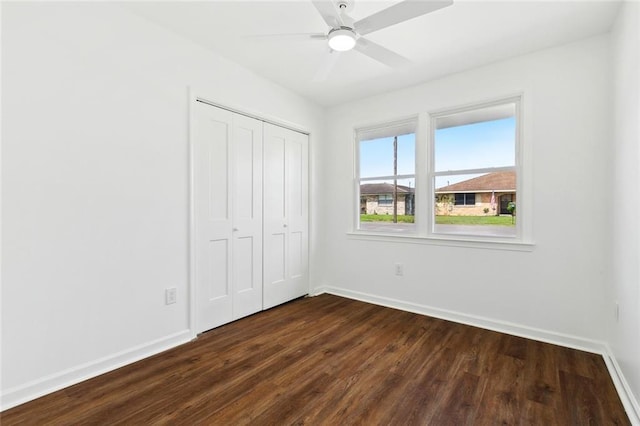 1221 Gaudet Dr, Marrero, LA 70072 - unfurnished bedroom featuring dark wood finished floors, a closet, and ceiling fan