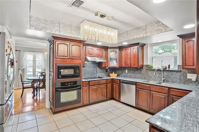 2442 Killdeer St, New Orleans, LA 70122 - kitchen featuring black appliances, a sink, healthy amount of natural light, decorative backsplash, and recessed lighting