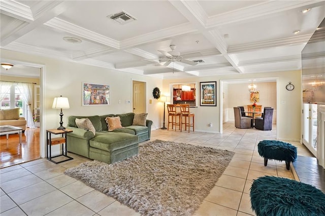 2442 Killdeer St, New Orleans, LA 70122 - living room featuring light tile patterned flooring, ornamental molding, a chandelier, coffered ceiling, and ceiling fan