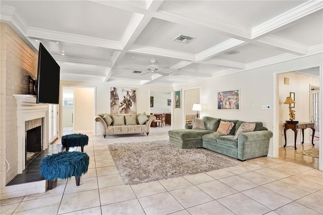 2442 Killdeer St, New Orleans, LA 70122 - living area featuring light tile patterned floors, beamed ceiling, coffered ceiling, a brick fireplace, and a ceiling fan