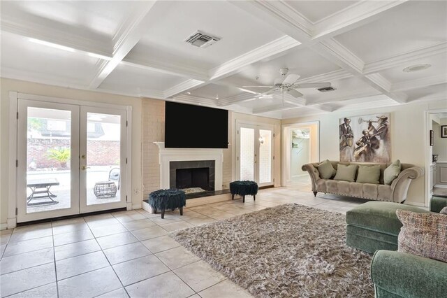 2442 Killdeer St, New Orleans, LA 70122 - living area with french doors, light tile patterned floors, coffered ceiling, beamed ceiling, and crown molding