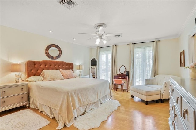 2442 Killdeer St, New Orleans, LA 70122 - bedroom featuring crown molding, light wood-type flooring, and ceiling fan