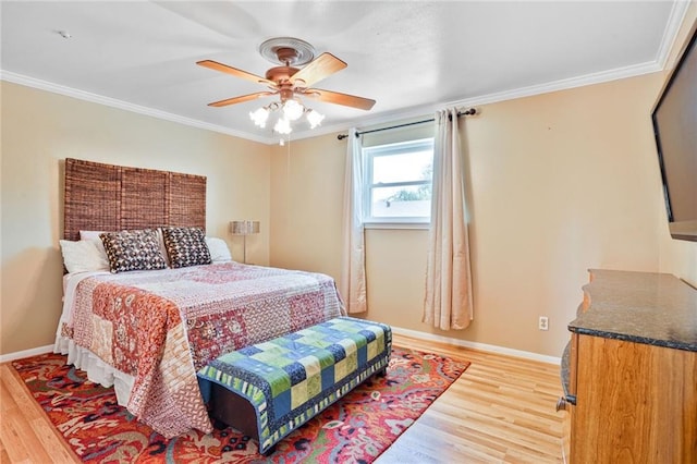 2442 Killdeer St, New Orleans, LA 70122 - bedroom featuring light wood finished floors, ornamental molding, baseboards, and a ceiling fan