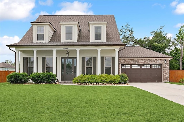 9574 W Terran Ln, Waggaman, LA 70094 - view of front facade featuring driveway, an attached garage, roof with shingles, a porch, and stucco siding