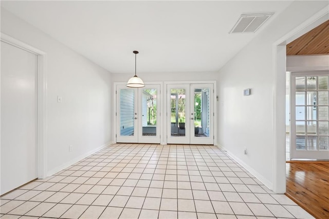 310 Scotchpine Dr, Mandeville, LA 70471 - unfurnished dining area featuring french doors and light tile patterned floors