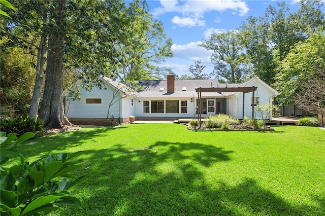310 Scotchpine Dr, Mandeville, LA 70471 - rear view of house featuring a lawn and a chimney