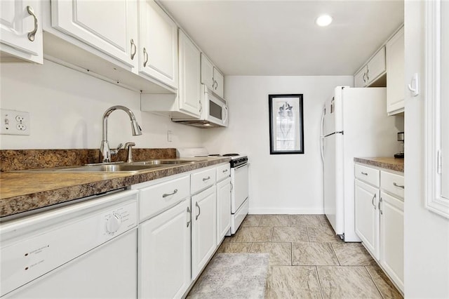 732 Cherokee St Unit 302, New Orleans, LA 70118 - kitchen with white appliances, white cabinets, baseboards, and recessed lighting