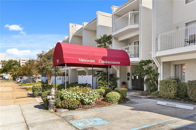 3805 Houma Blvd Unit C101, Metairie, LA 70006 - view of building exterior featuring uncovered parking