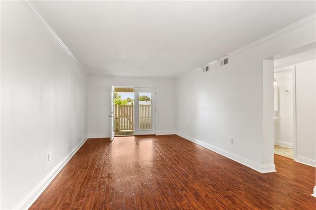 3805 Houma Blvd Unit C101, Metairie, LA 70006 - spare room with wood finished floors, baseboards, and ornamental molding