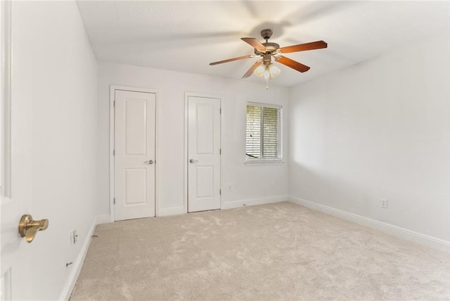 3805 Houma Blvd Unit C101, Metairie, LA 70006 - unfurnished bedroom with light carpet, baseboards, and ceiling fan
