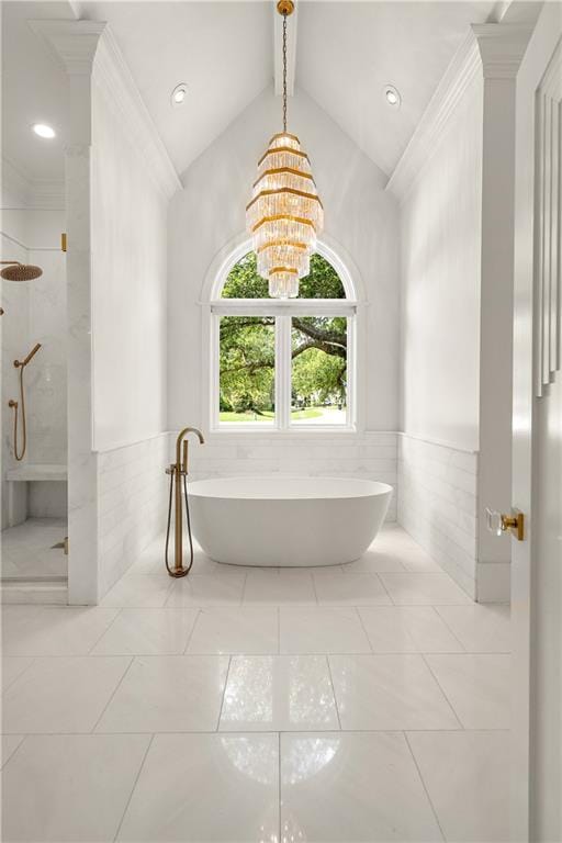 139 Fontainbleau Dr, Mandeville, LA 70471 - full bathroom featuring a walk in shower, tile walls, a freestanding bath, wainscoting, and a chandelier