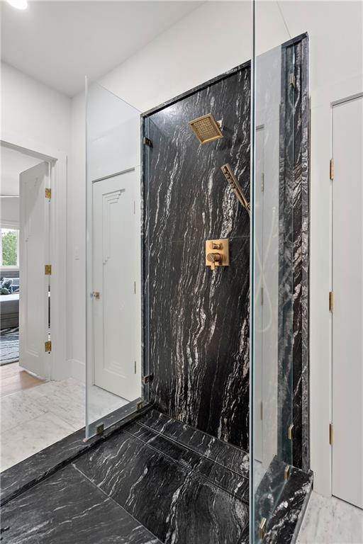 139 Fontainbleau Dr, Mandeville, LA 70471 - full bathroom with a marble finish shower and marble tiled floors