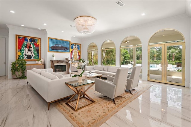 139 Fontainbleau Dr, Mandeville, LA 70471 - living room featuring light marble finish flooring, recessed lighting, crown molding, a premium fireplace, and french doors
