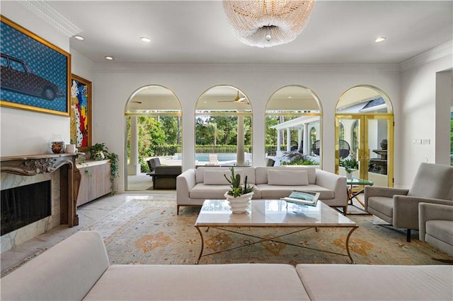 139 Fontainbleau Dr, Mandeville, LA 70471 - living room featuring a fireplace, crown molding, recessed lighting, and a chandelier