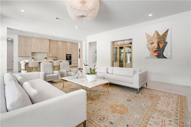 139 Fontainbleau Dr, Mandeville, LA 70471 - living room featuring recessed lighting, ornamental molding, a chandelier, and baseboards