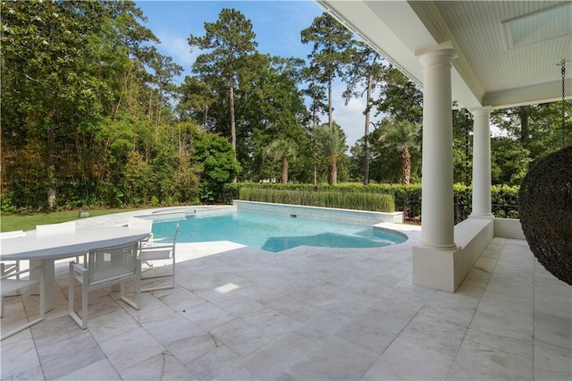 139 Fontainbleau Dr, Mandeville, LA 70471 - outdoor pool with a patio area, view of scattered trees, and outdoor dining space