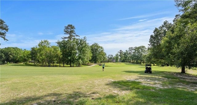 139 Fontainbleau Dr, Mandeville, LA 70471 - view of home's community with view of scattered trees, a lawn, and golf course view