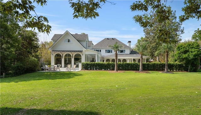 139 Fontainbleau Dr, Mandeville, LA 70471 - back of house featuring a patio area and a lawn