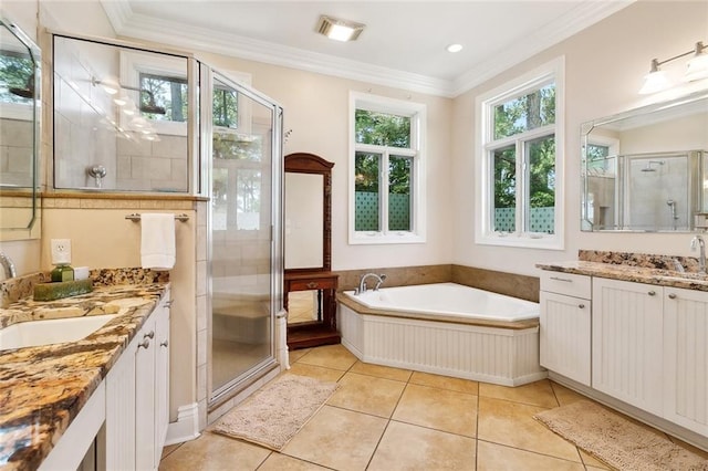 26545 Mildred Dr, Lacombe, LA 70445 - bathroom with two vanities, a shower stall, a bath, tile patterned flooring, and ornamental molding