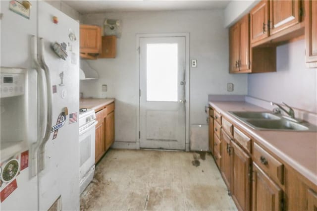 717 E Jefferson Park, Jefferson, LA 70121 - kitchen featuring white appliances, light countertops, brown cabinetry, and light wood-style floors