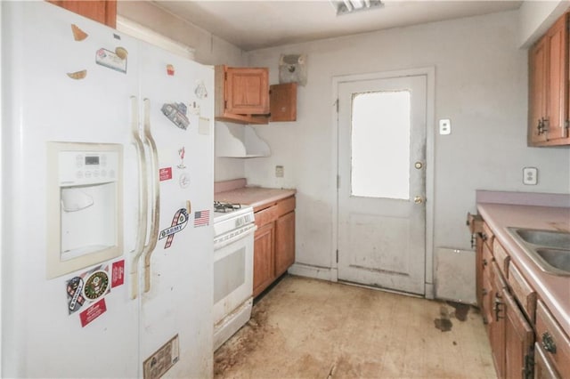 717 E Jefferson Park, Jefferson, LA 70121 - kitchen featuring white appliances, brown cabinetry, and light countertops