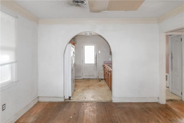 717 E Jefferson Park, Jefferson, LA 70121 - unfurnished room featuring plenty of natural light, light wood-style flooring, arched walkways, and crown molding