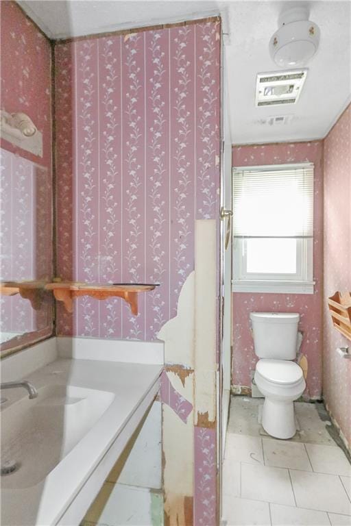 717 E Jefferson Park, Jefferson, LA 70121 - bathroom with wallpapered walls and tile patterned flooring