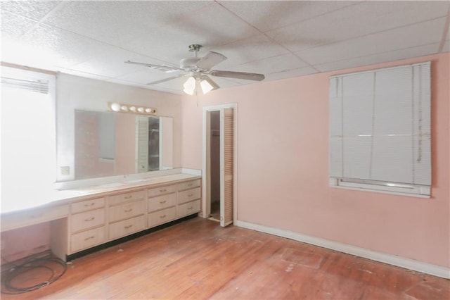 717 E Jefferson Park, Jefferson, LA 70121 - bathroom featuring wood finished floors, vanity, ceiling fan, and a drop ceiling